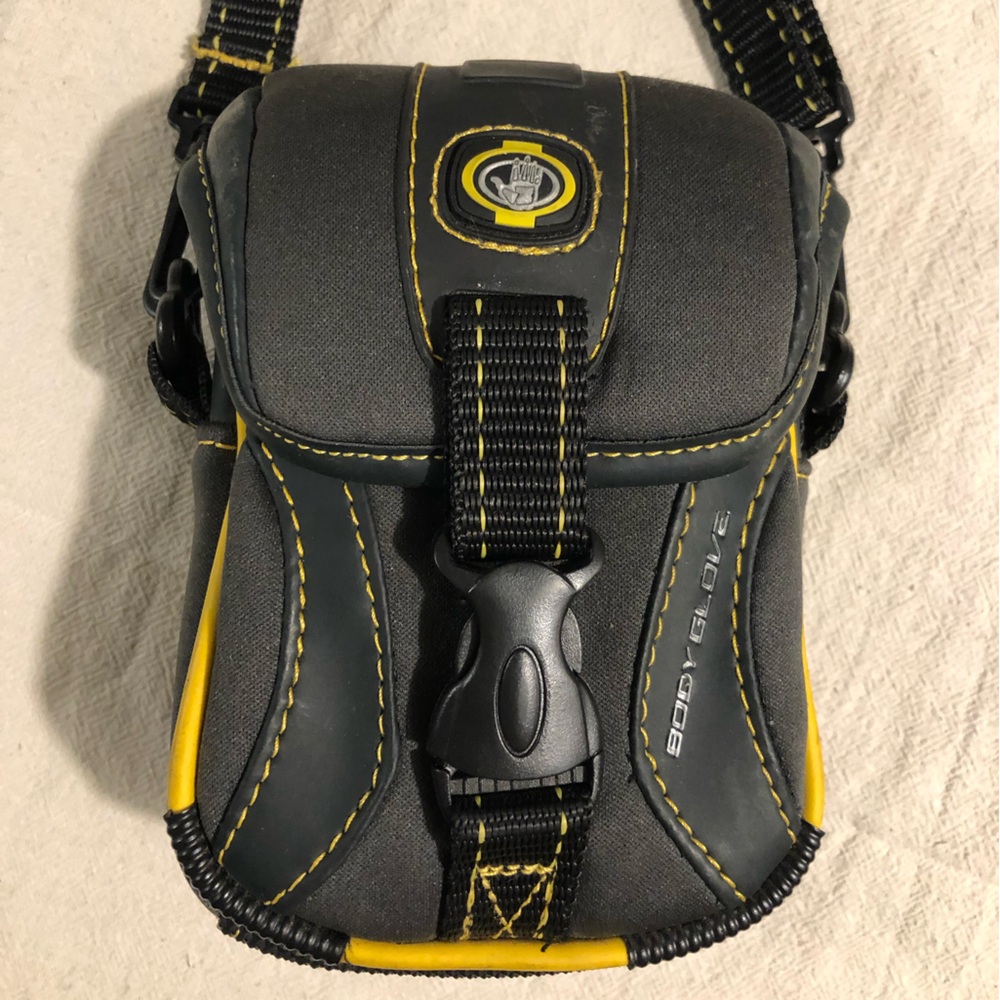 BODY GLOVE Crossbody bag. 4”w x 6”h x 2”d. Black w/yellow. Adjustable strap 21”.